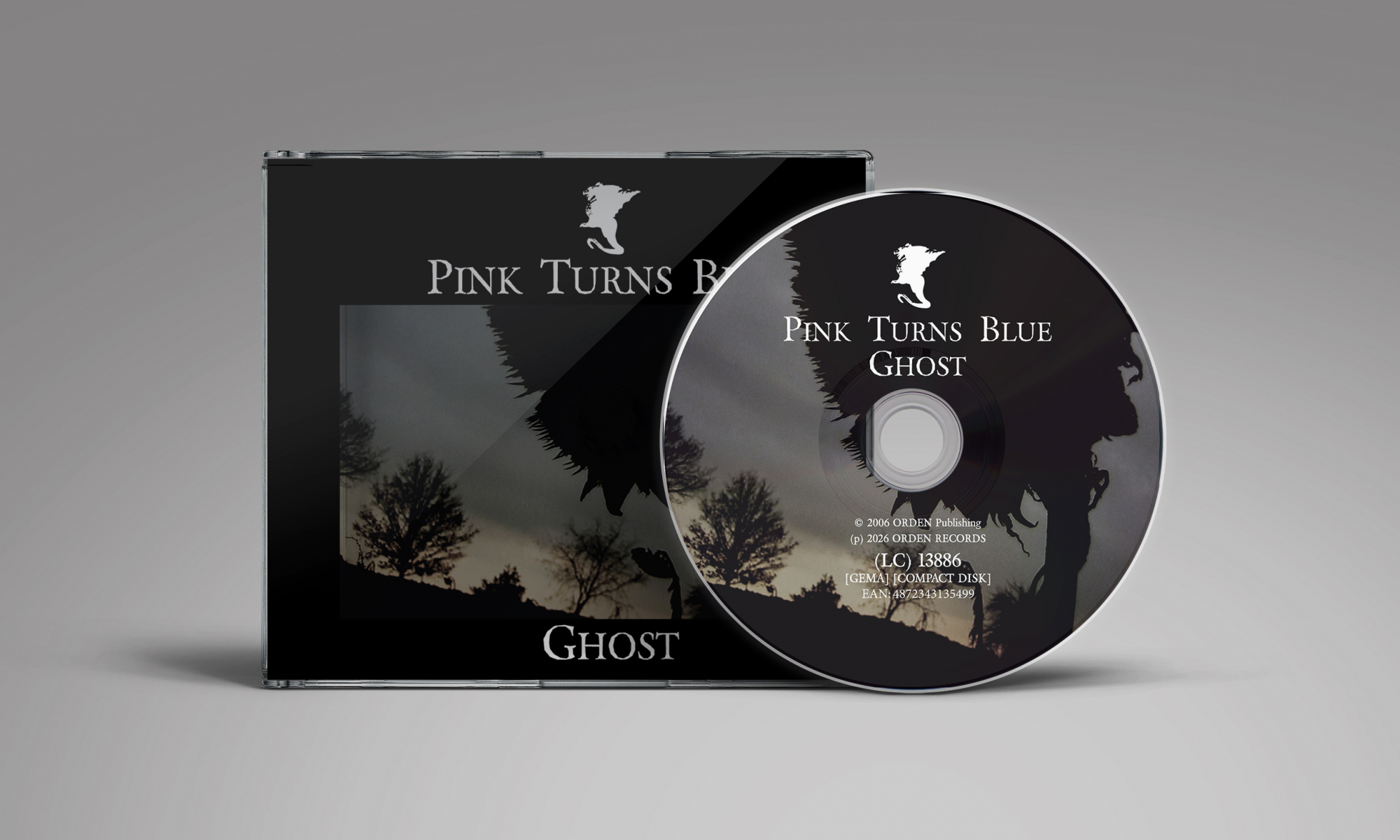 CD case and disc displaying the album title 'Pink Turns Blue – Ghost' with dark silhouette artwork and trees in the background.